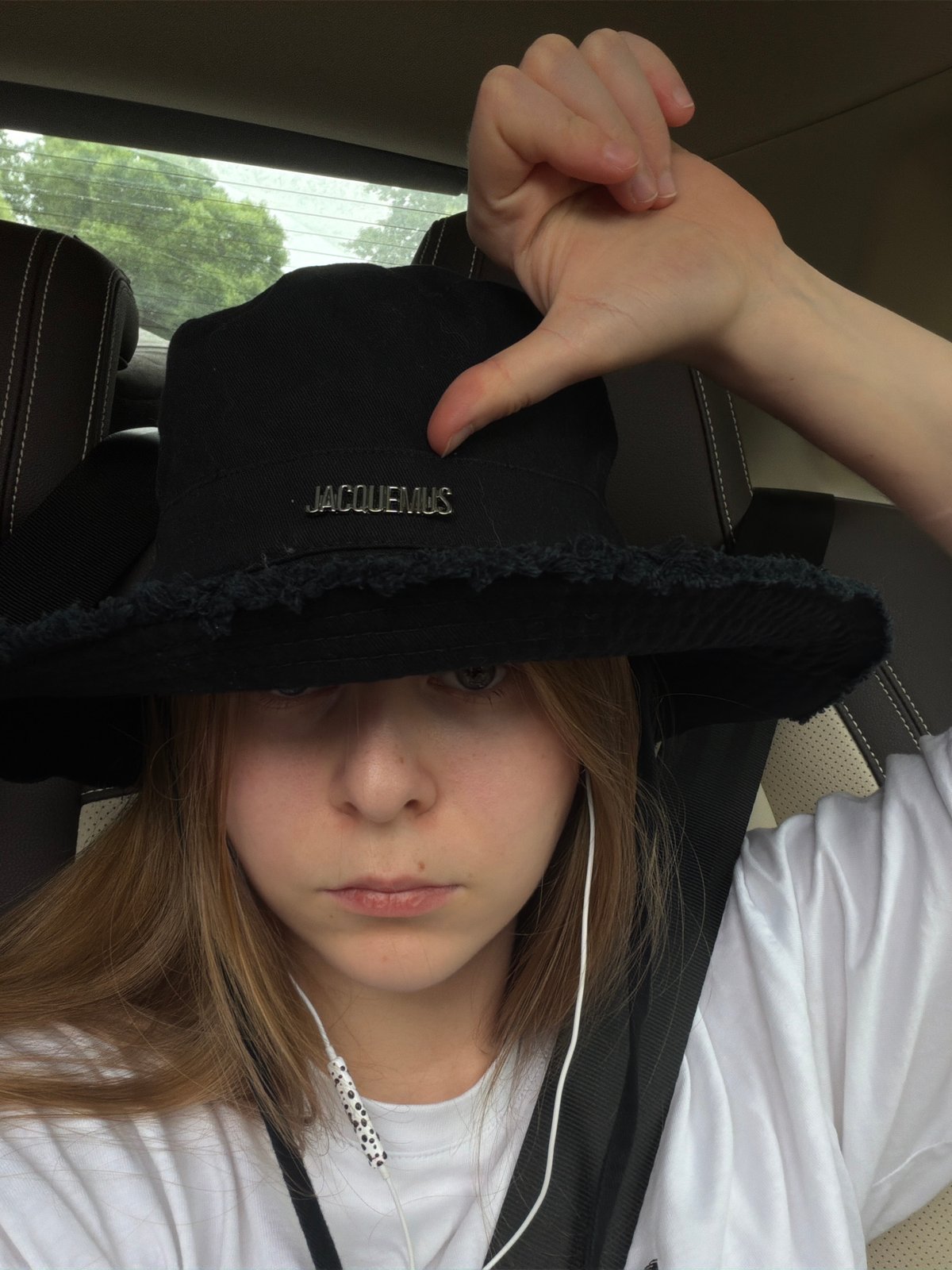 In-car selfie session near Vnukovo airport, Jacquemus hat front and center