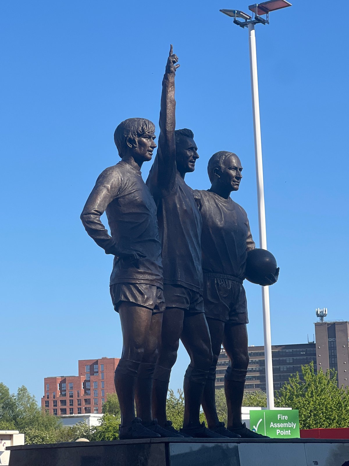 Bronze football statue observed at Old Trafford stadium