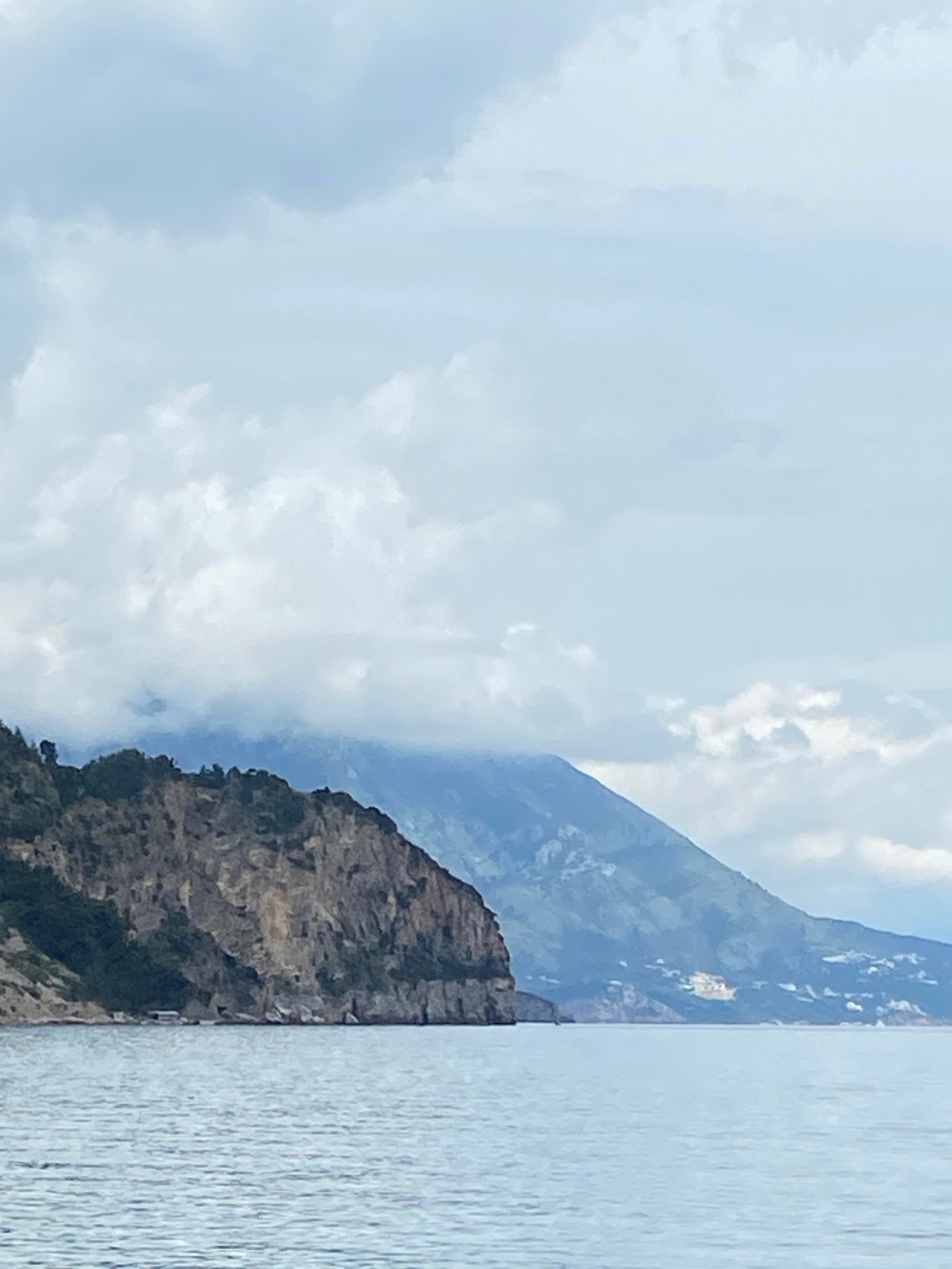 Coastal scenery documented in Prijevor, Montenegro shows cliffs and boats