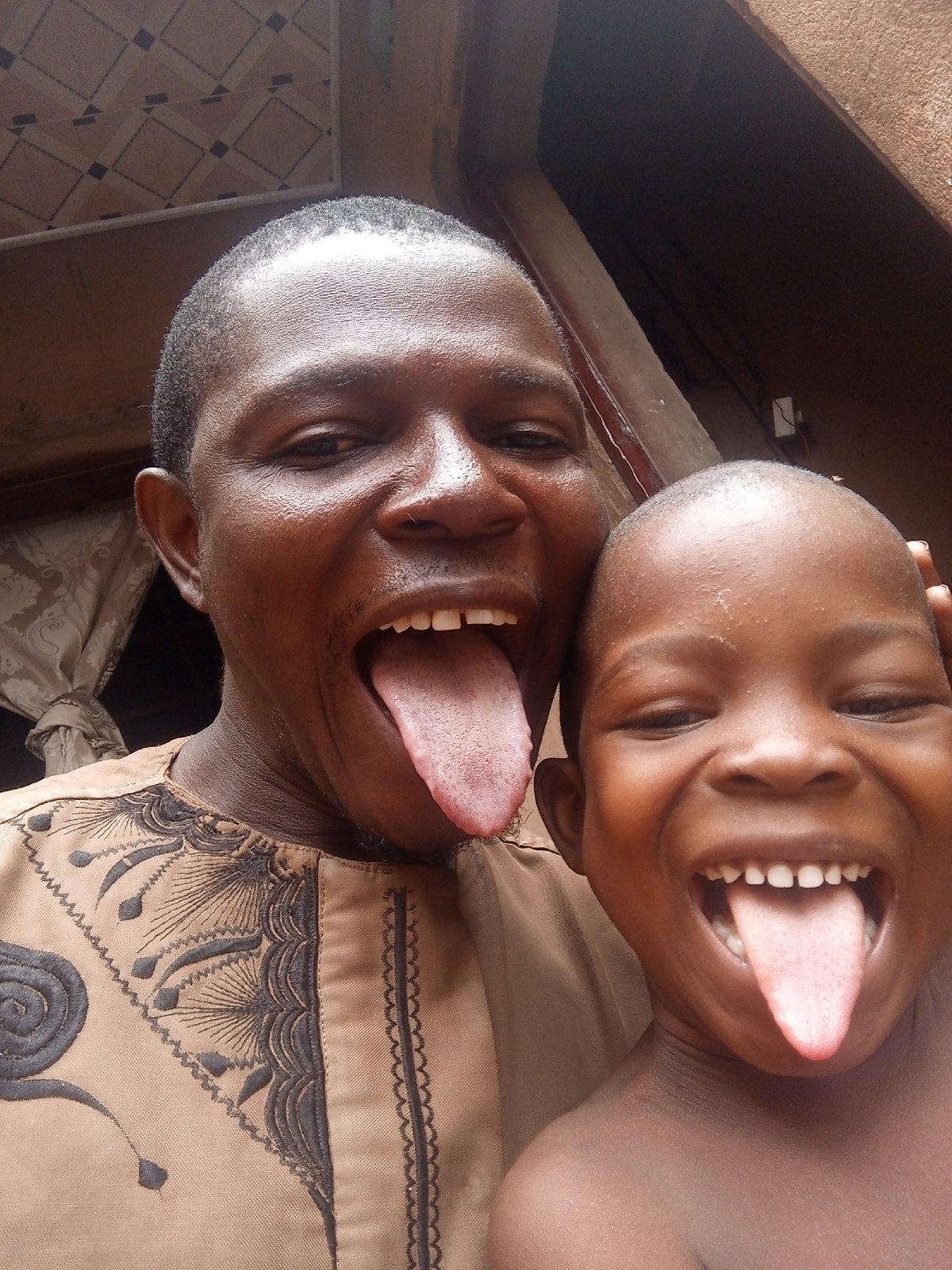 Father and child photographed together in Tempure, Nigeria