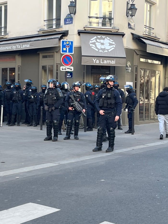 Police in riot gear deployed at Paris intersection