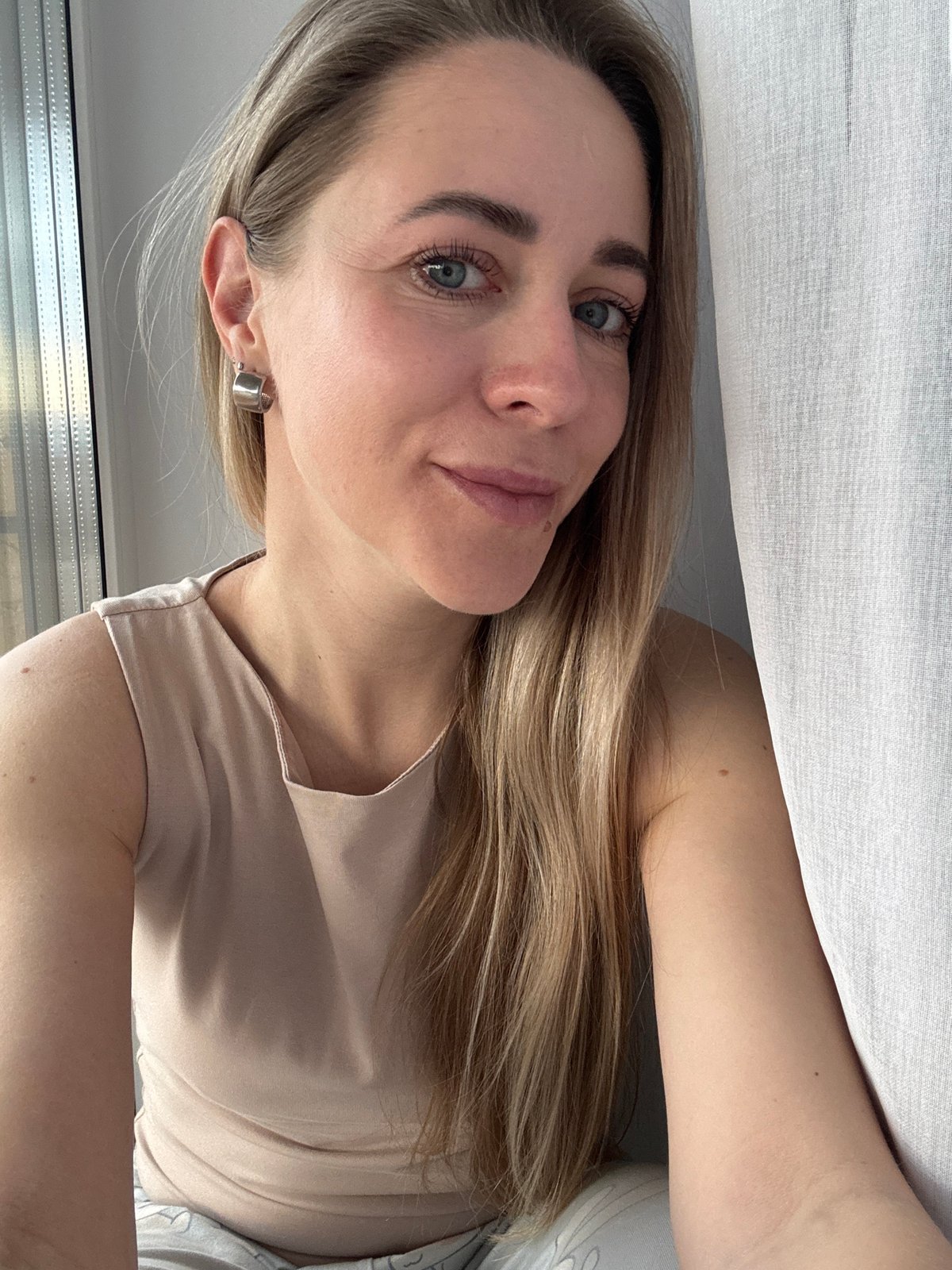 Woman takes selfies indoors in Chaikovsky, Russia