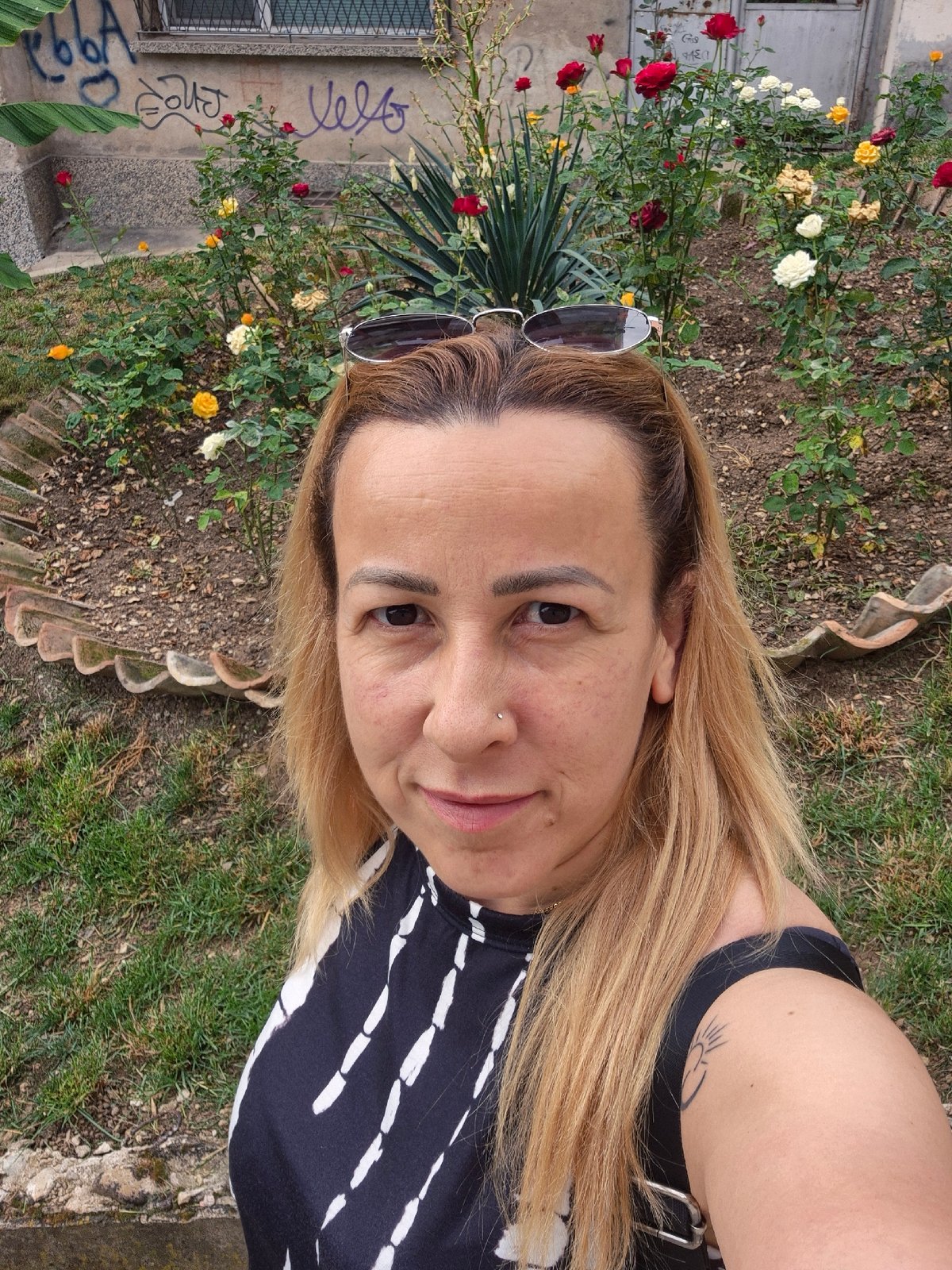 Selfie session at a rose garden with city views