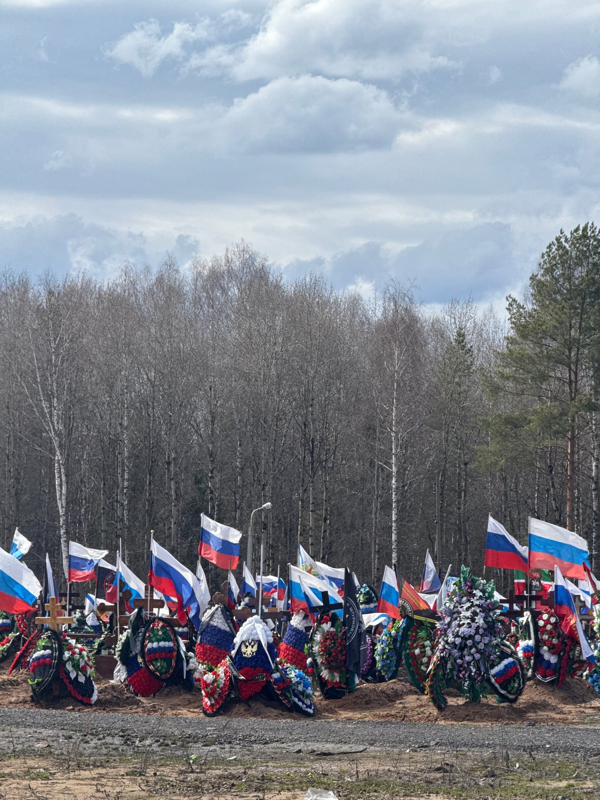 Russian flags mark graves at Perm cemetery memorial
