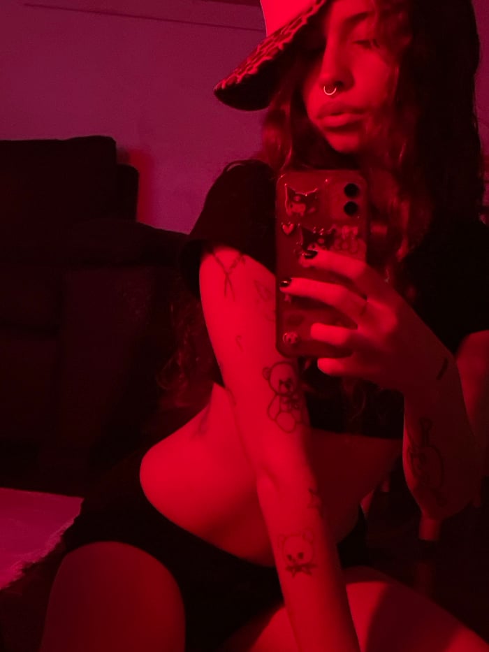 Young woman takes multiple mirror selfies in Buenos Aires