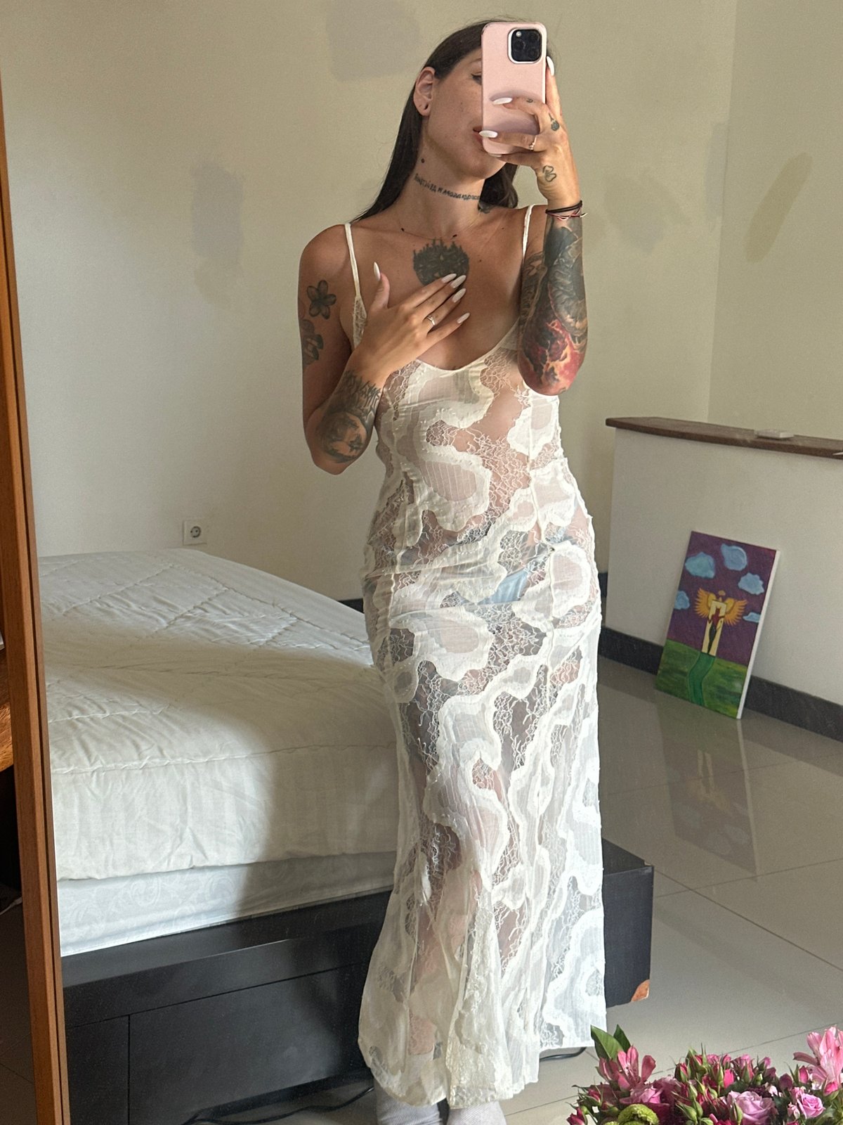 Tattoo-heavy mirror selfies from a North Kuta room, Bali
