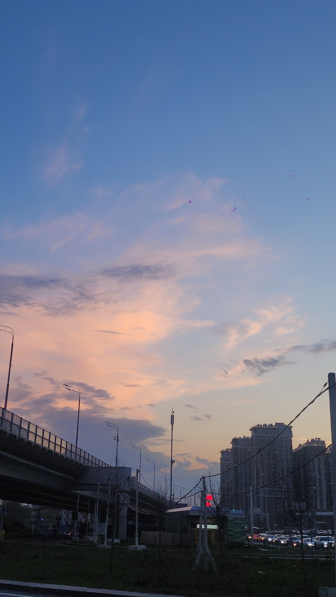Moscow sunset observed over highway overpass and urban infrastructure