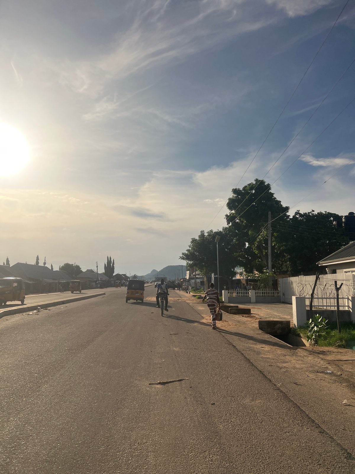 Afternoon sunlight illuminates streets and buildings in Jalingo, Nigeria