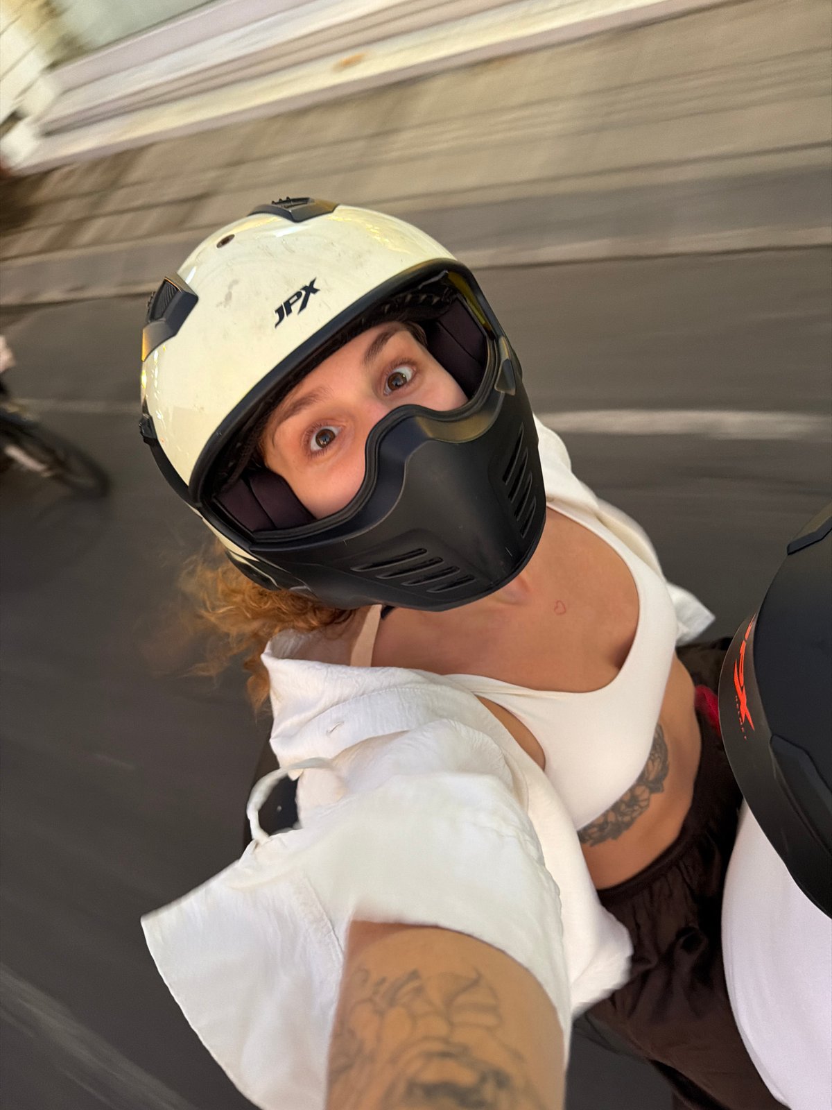 Woman documents evening motorcycle rides and selfies in Bali