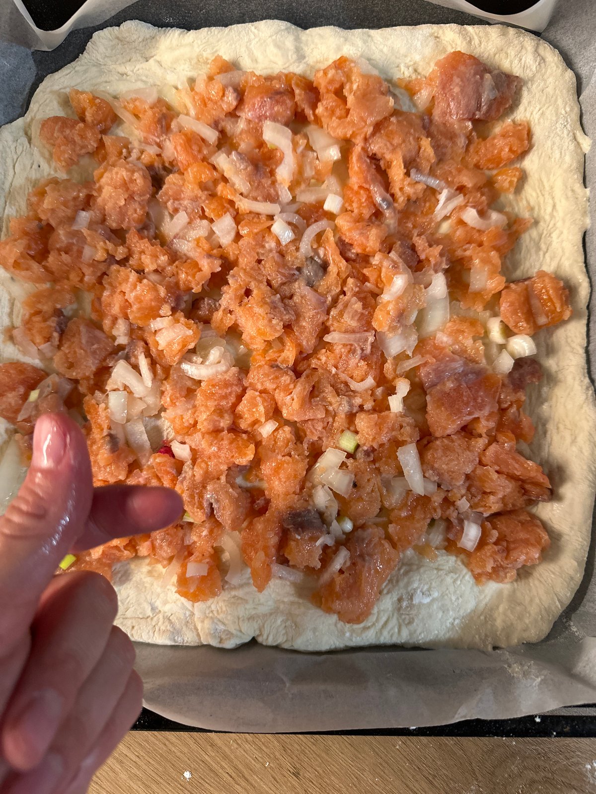 Woman prepares dough, shares meal with child in Fethiye