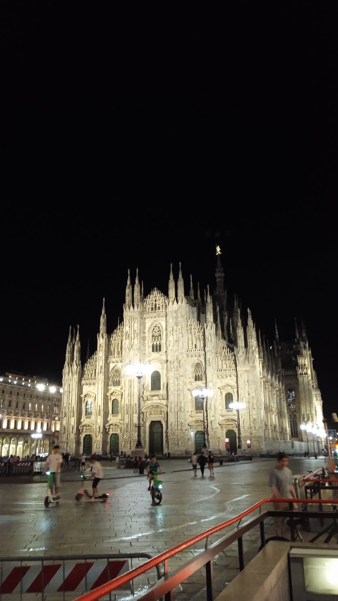 Milan's Duomo glows against the night sky