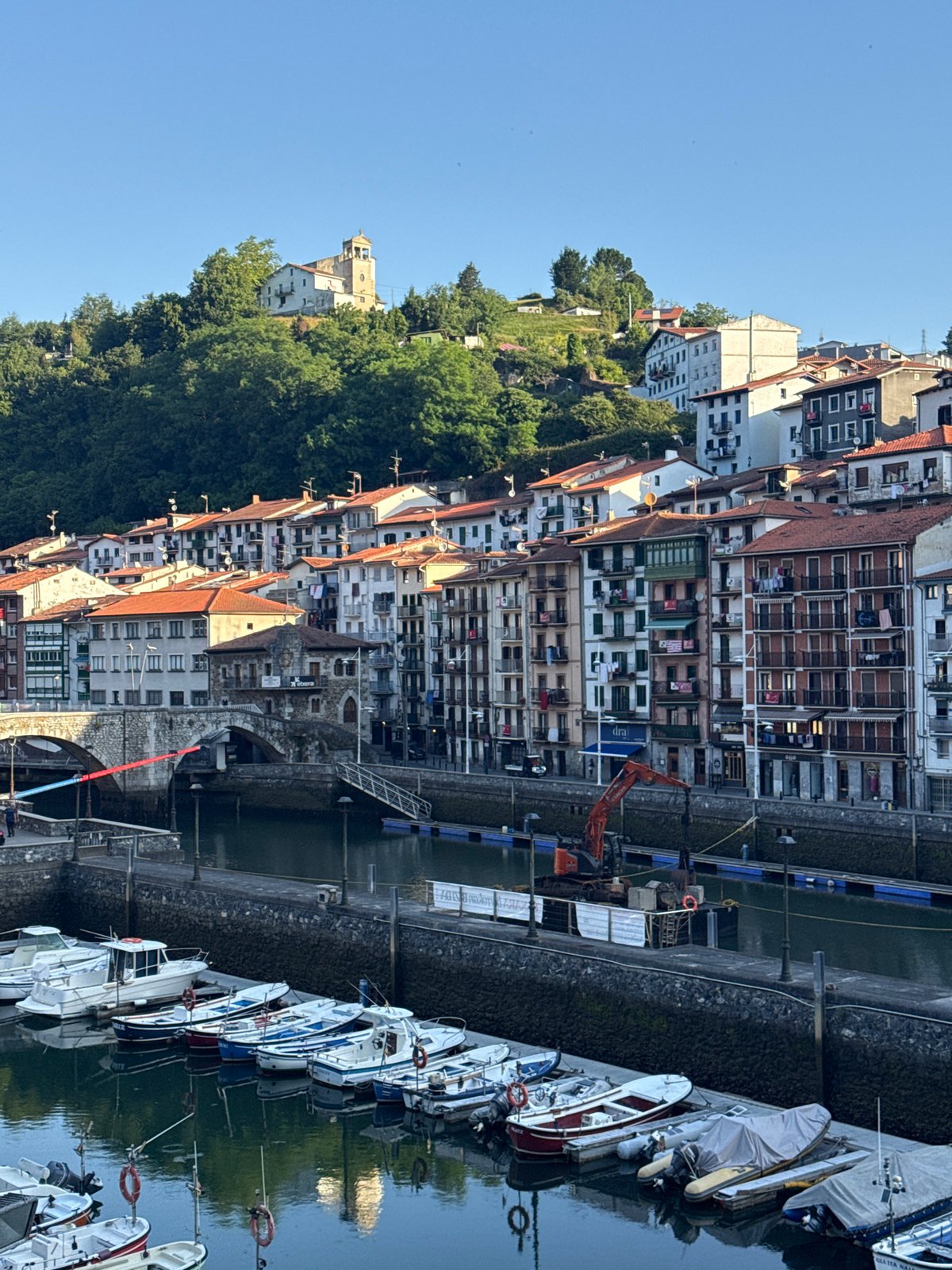 Morning harbor views across Ondarroa's waterfront and hillside