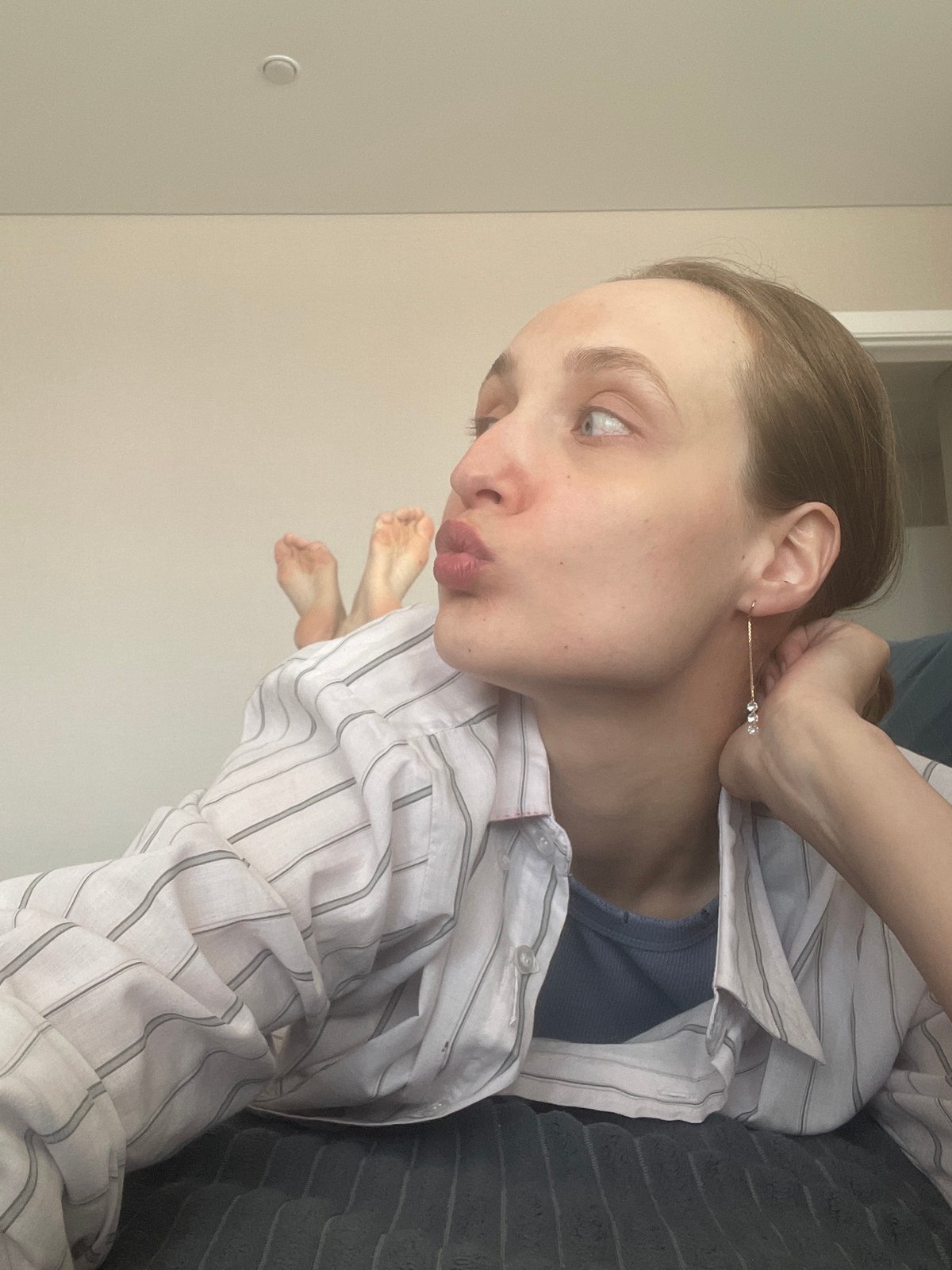 Woman resting indoors during midday in Sepych, Russia
