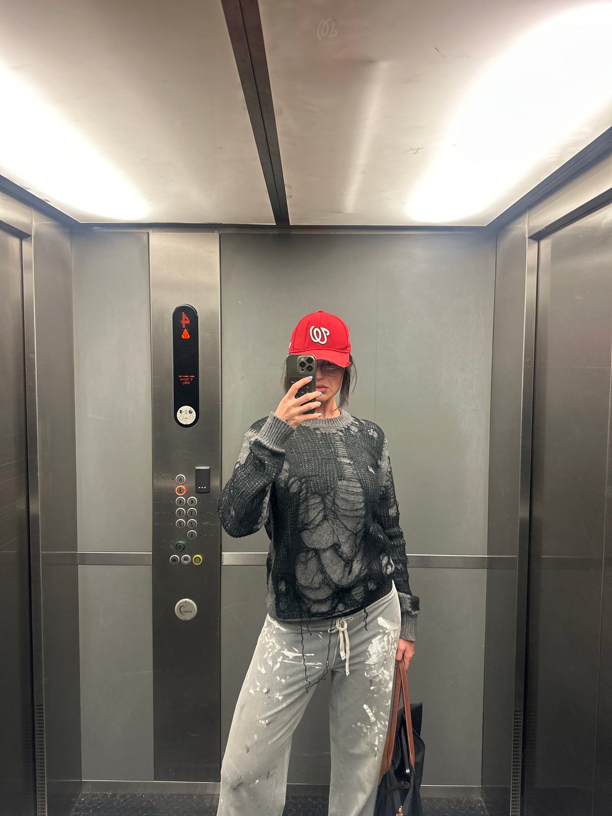 Paint-splattered person takes selfies across central London locations