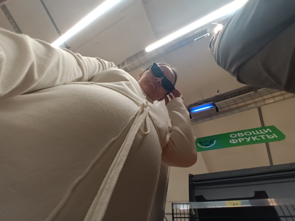 Shoppers photographed in Chaikovsky grocery store produce section