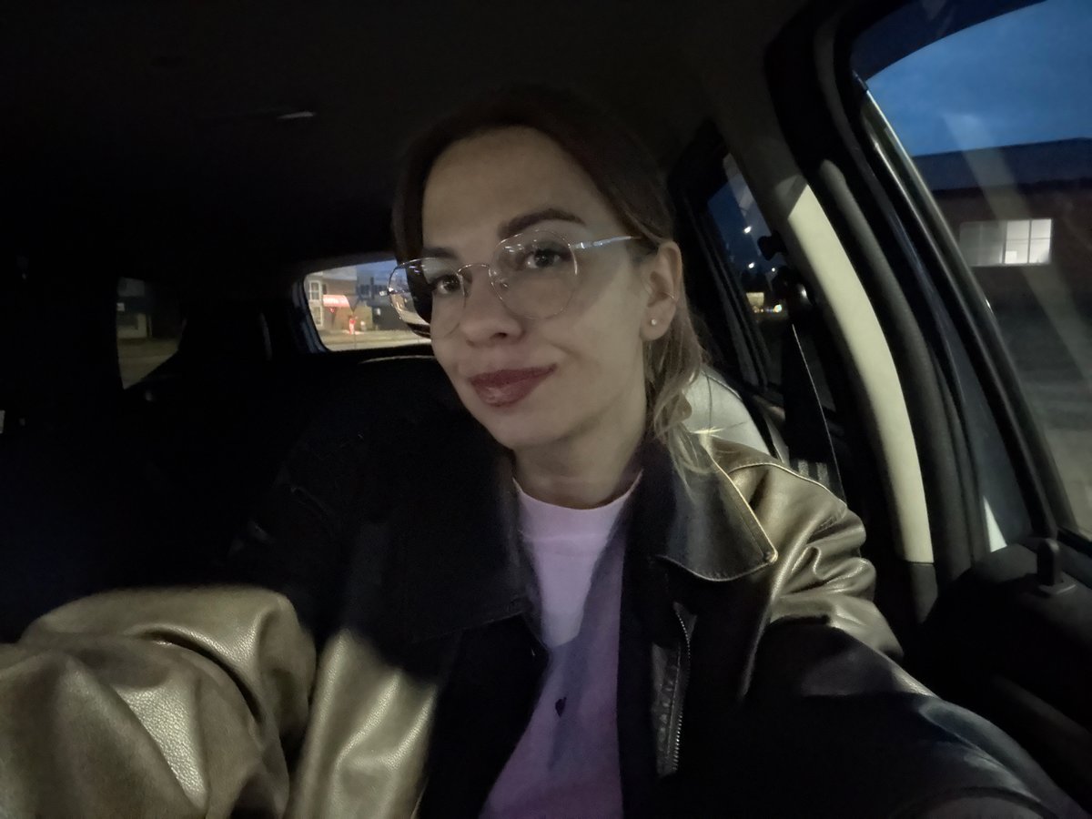 Person in leather jacket photographed inside car in Ust-Ilimsk
