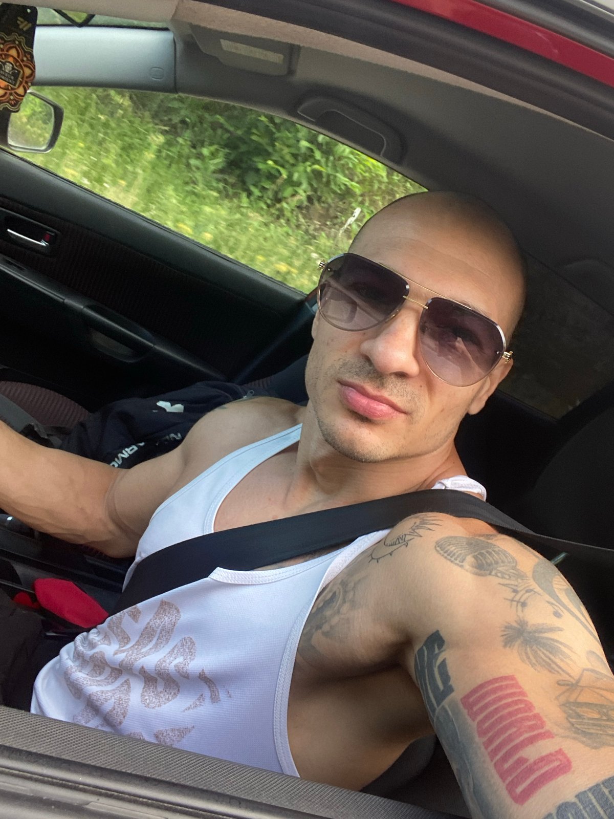 Tattooed man performs stunts, poses in early morning Pleven sequence