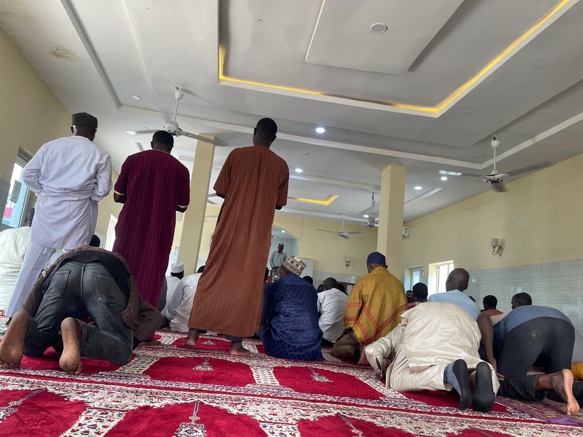 Friday prayers and street scenes at a mosque in Abuja