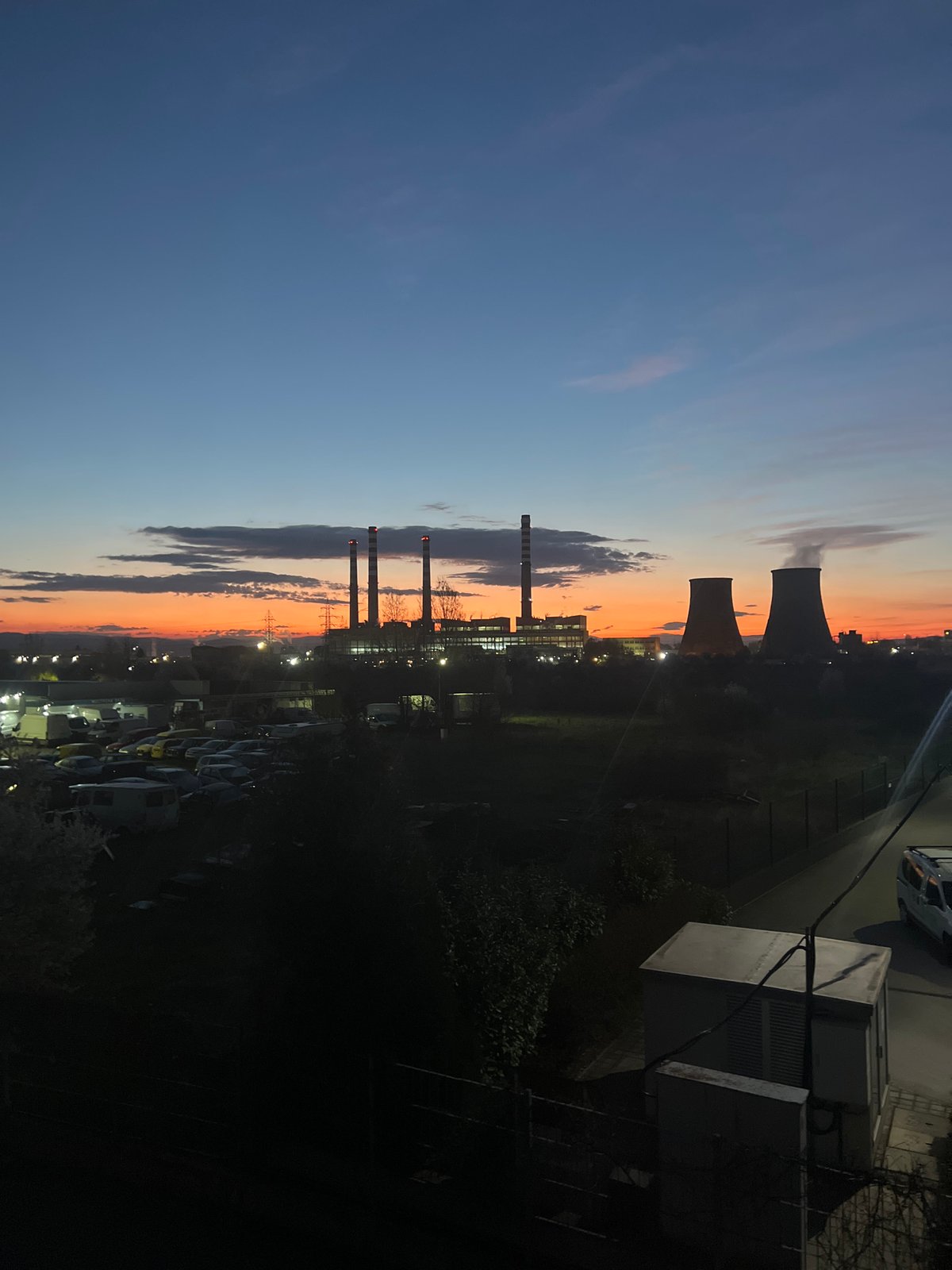 Industrial area with smokestacks observed at dusk in Sofia