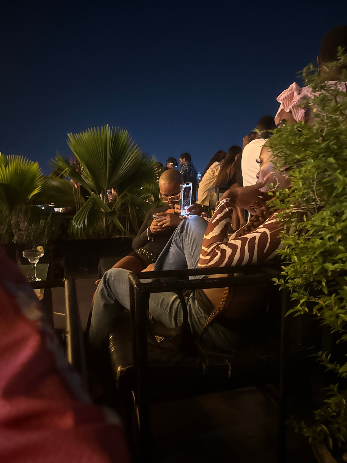 Evening outdoor gathering documented in Ado, Nigeria