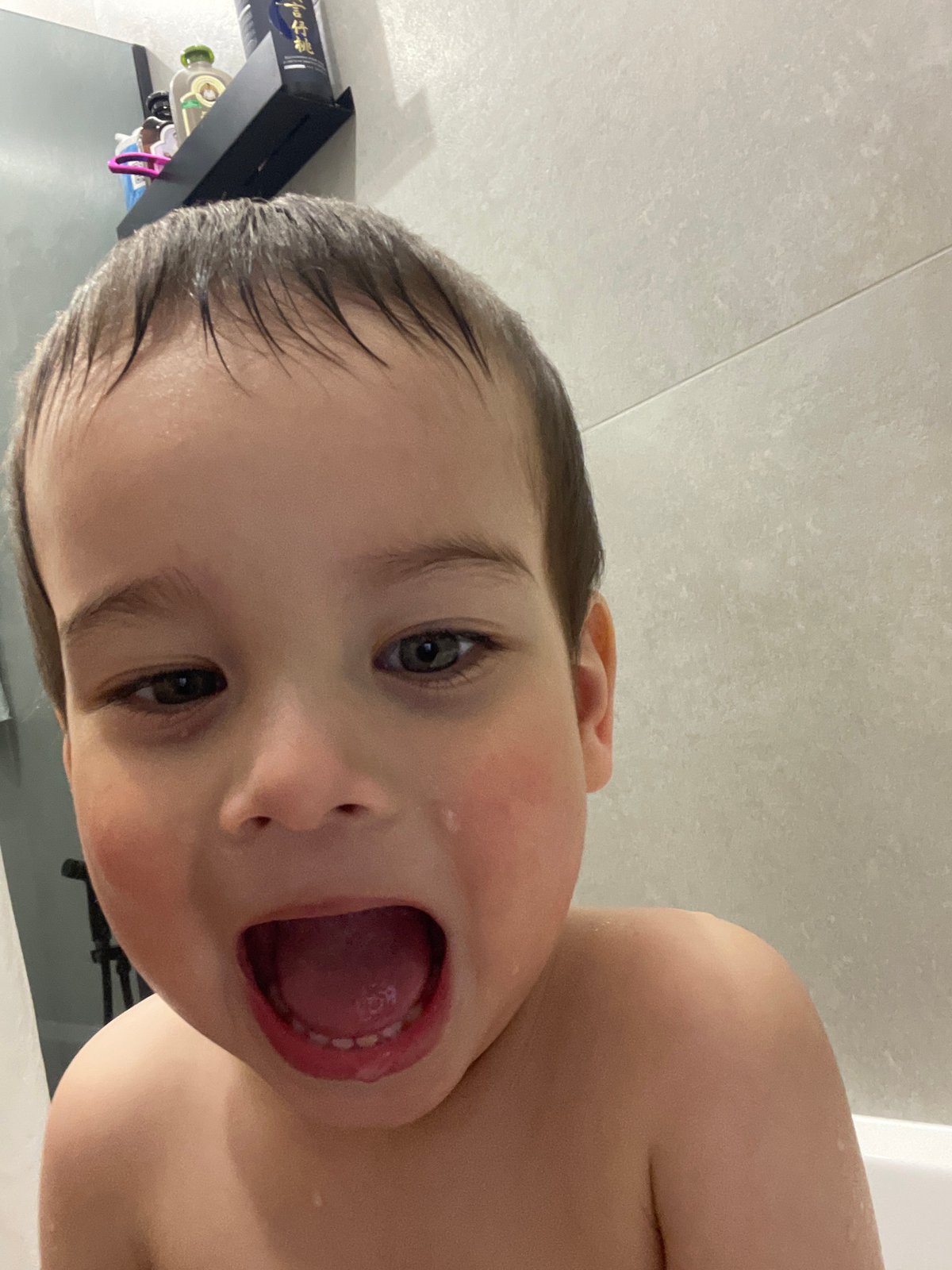 Toddler observed during bath time in Izhevsk bathroom