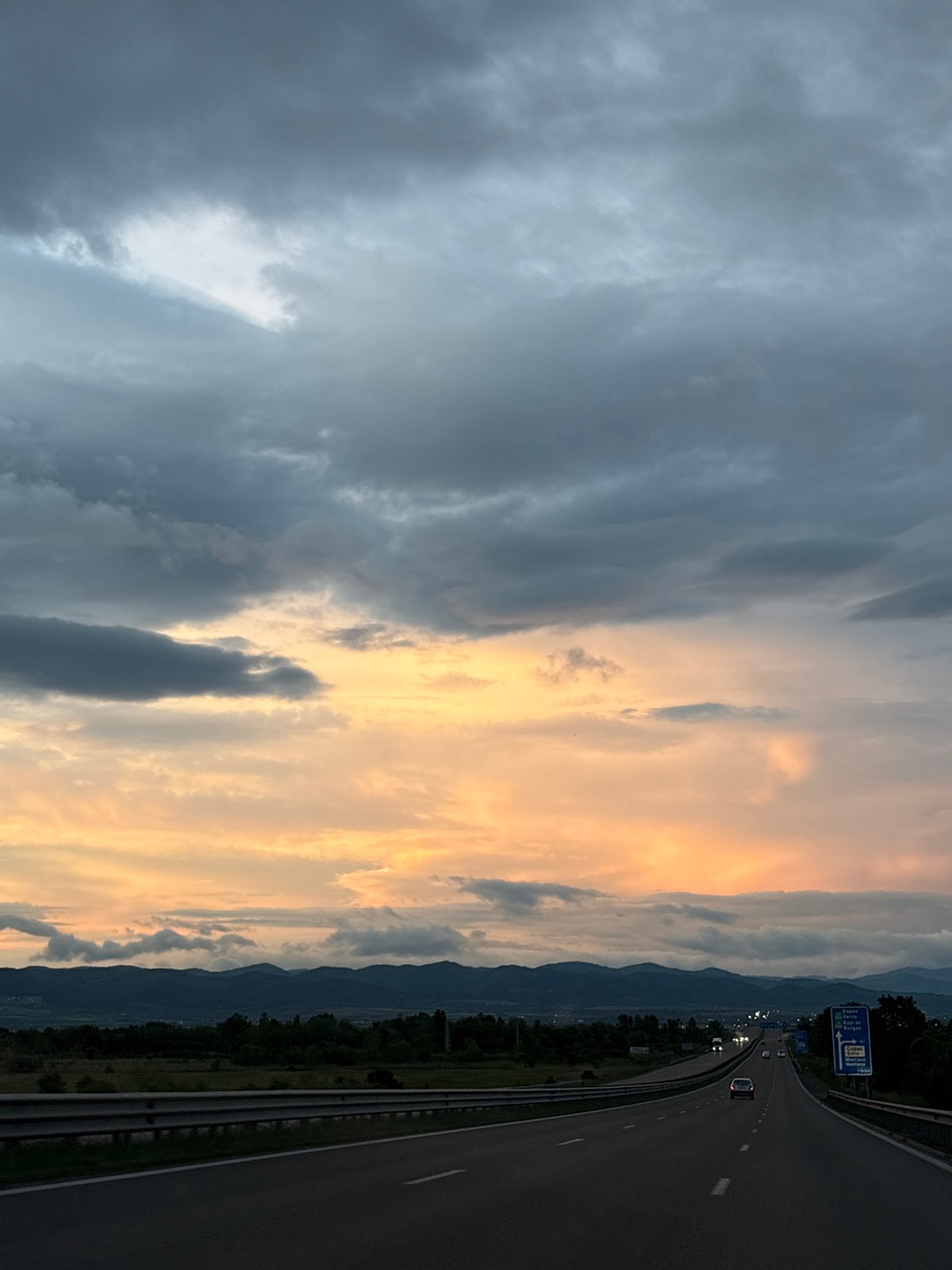 Highway scene captured near Sofia with mountains, dramatic sky