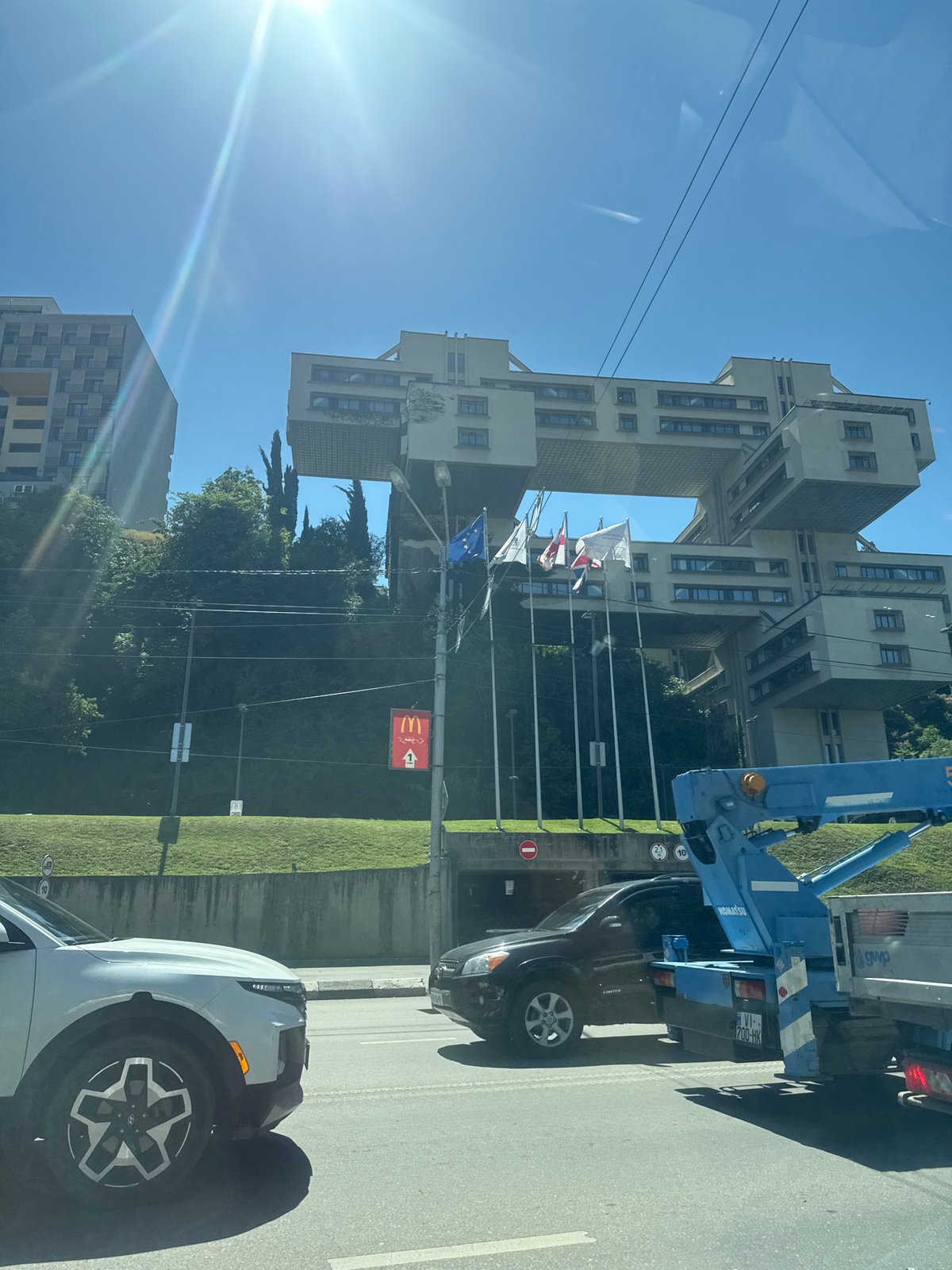 Driver documents sunny morning journey through Tbilisi's Soviet architecture