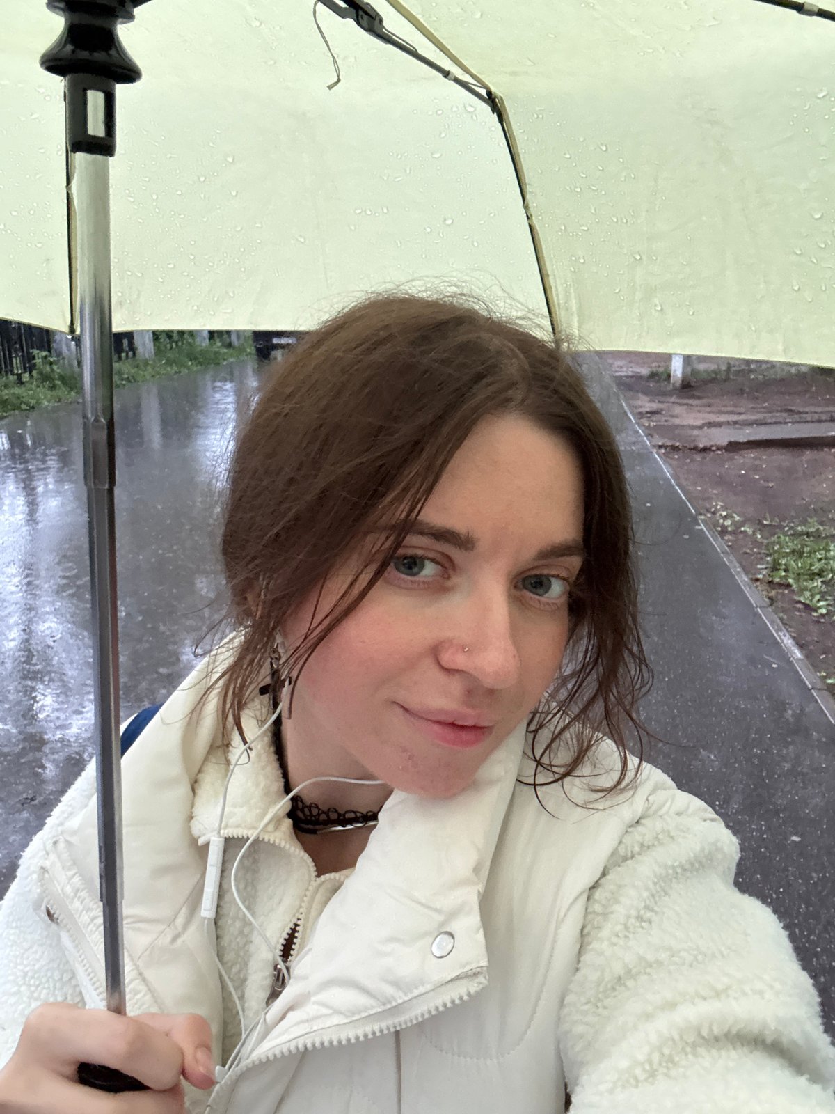 Rainy day selfies under a yellow umbrella