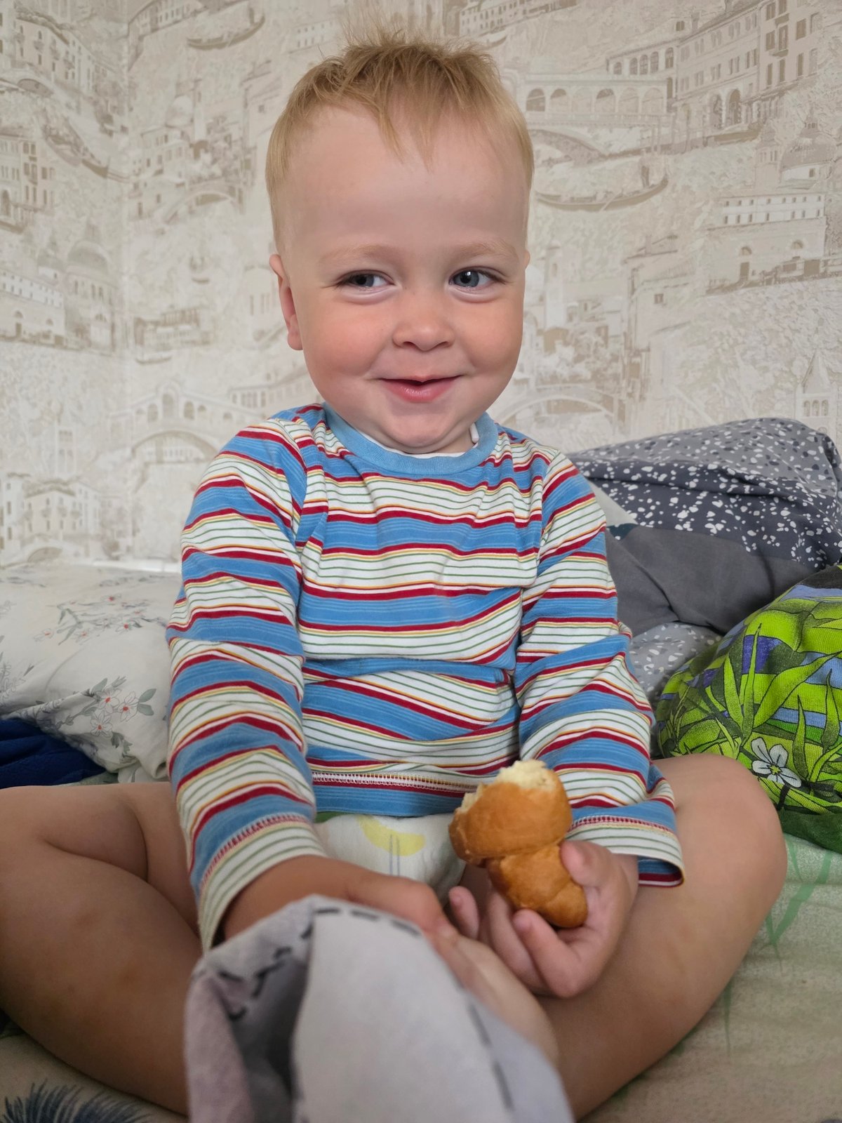Toddler's smile and rainy garden captured in morning moments