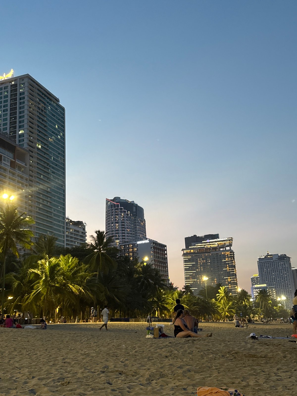 Tourist documents daily life scenes across Nha Trang Vietnam
