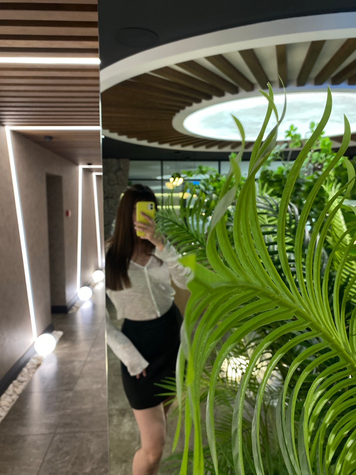 Mirror selfies inside a sleek Votkinsk boutique space