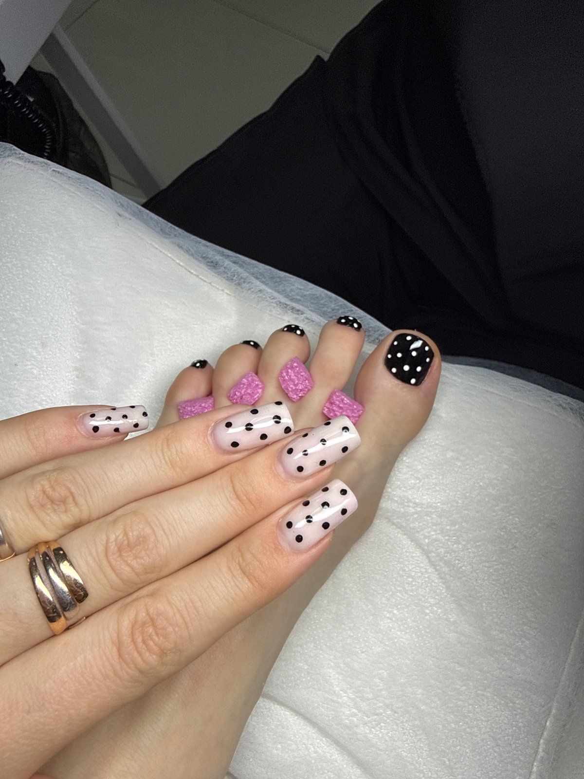 Pink polka dot manicure displayed in Batumi, Georgia