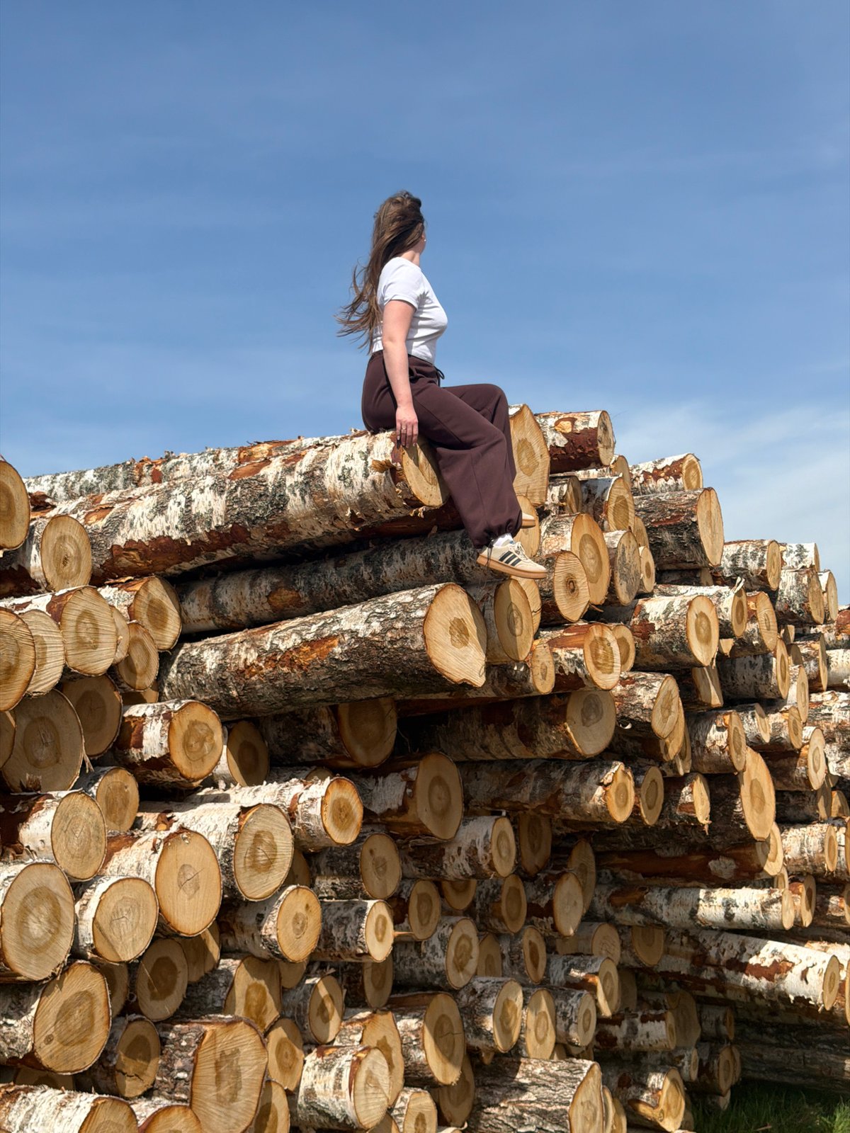 Woman photographed among birch trees in Russian countryside