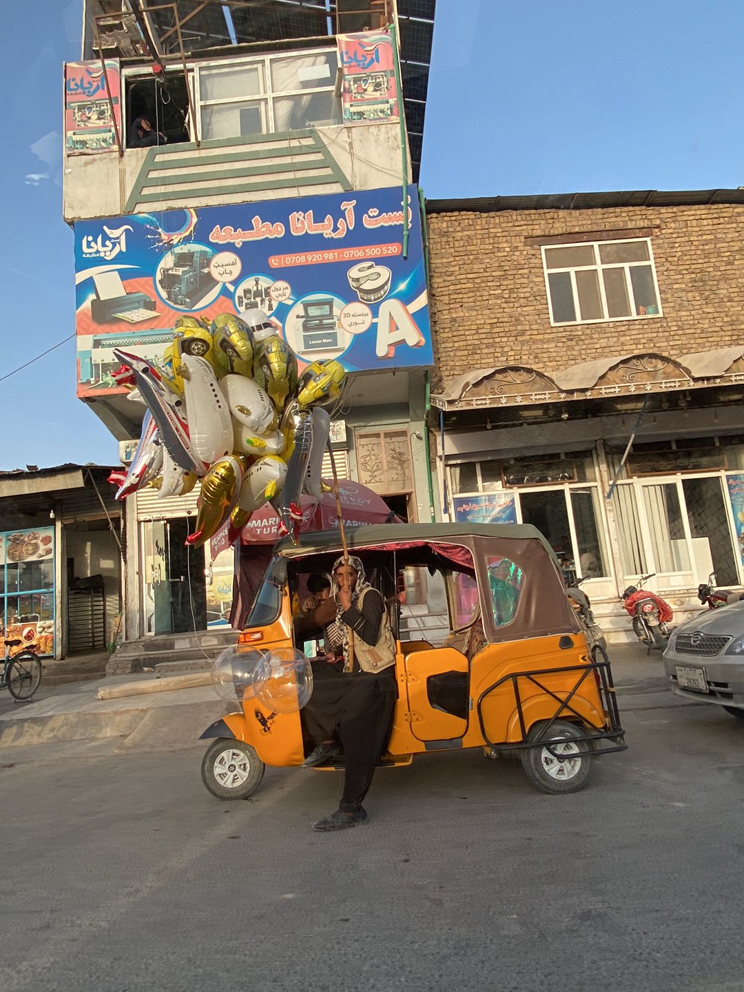 Daily street life documented across Kandahar commercial districts
