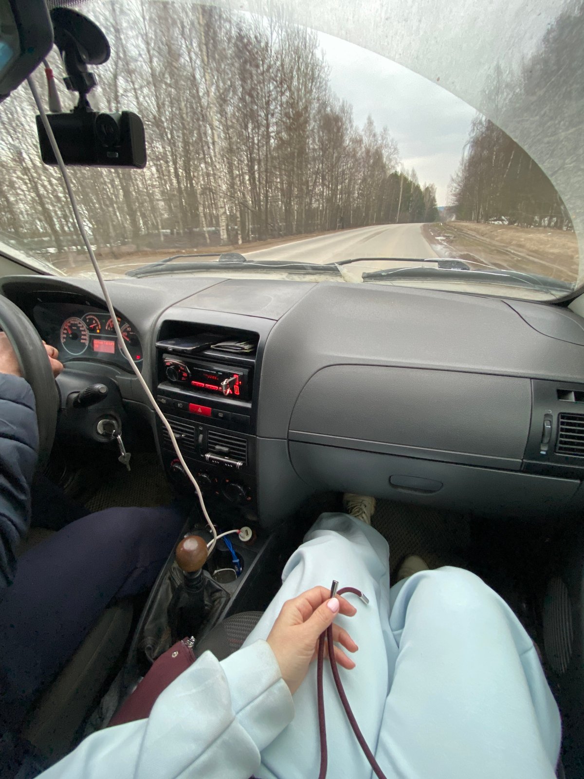 Two people travel by car in Ol'khovskoye, Russia
