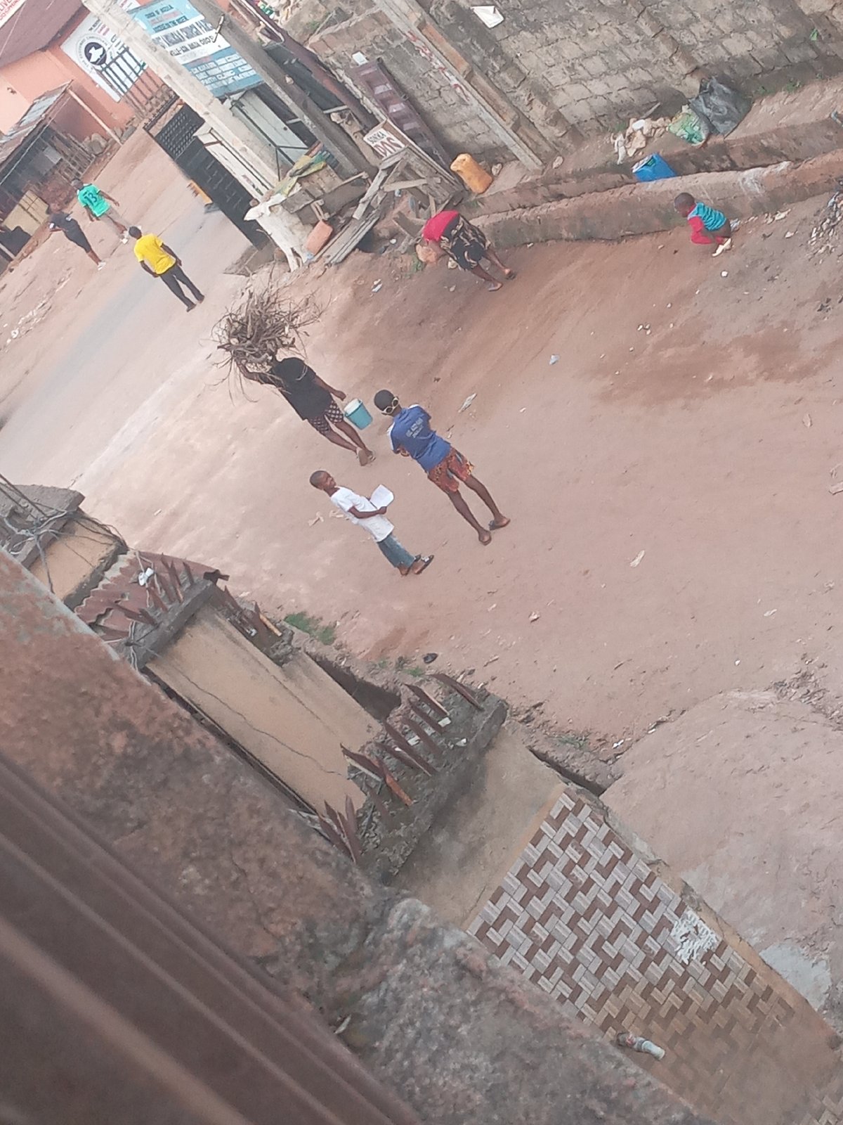 Urban street scene captured from elevated angle shows pedestrians