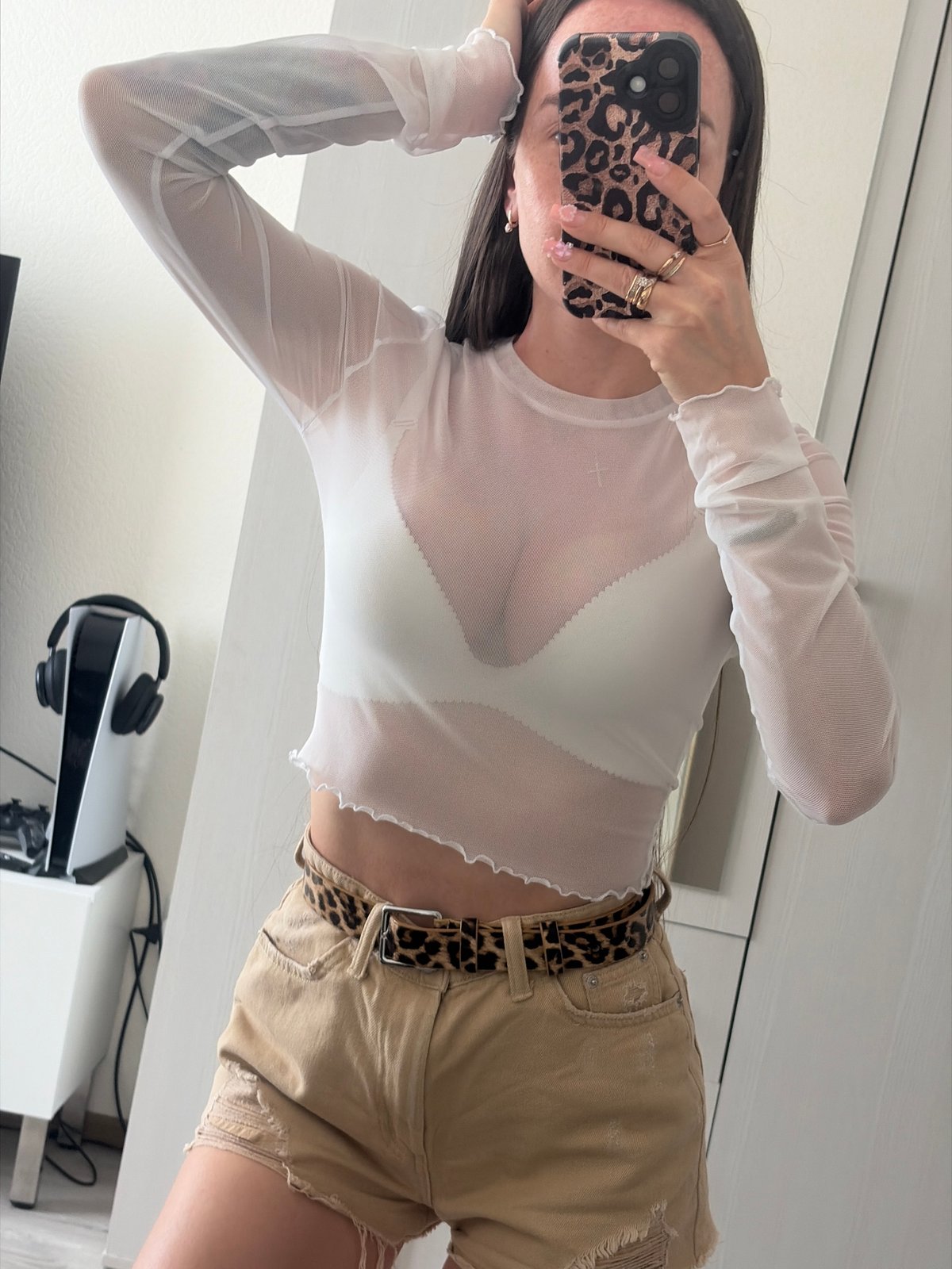 Woman Takes Mirror Selfie in Bedroom