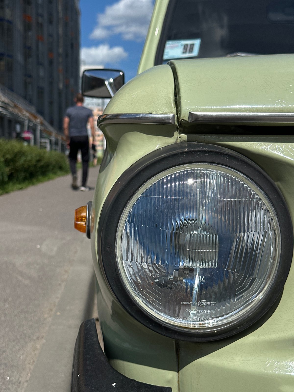 Weathered Soviet-era car parked on a Murino street