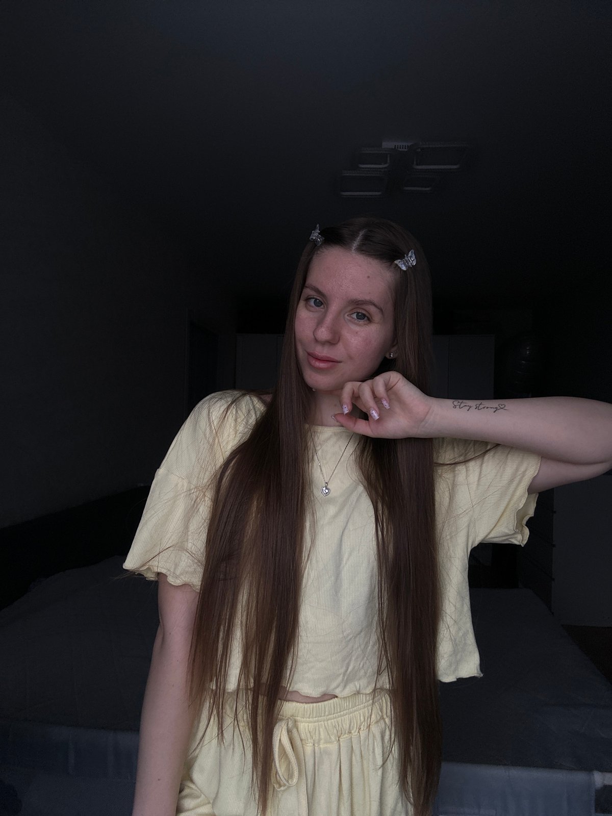 Woman photographed in bedroom setting in Klin, Russia