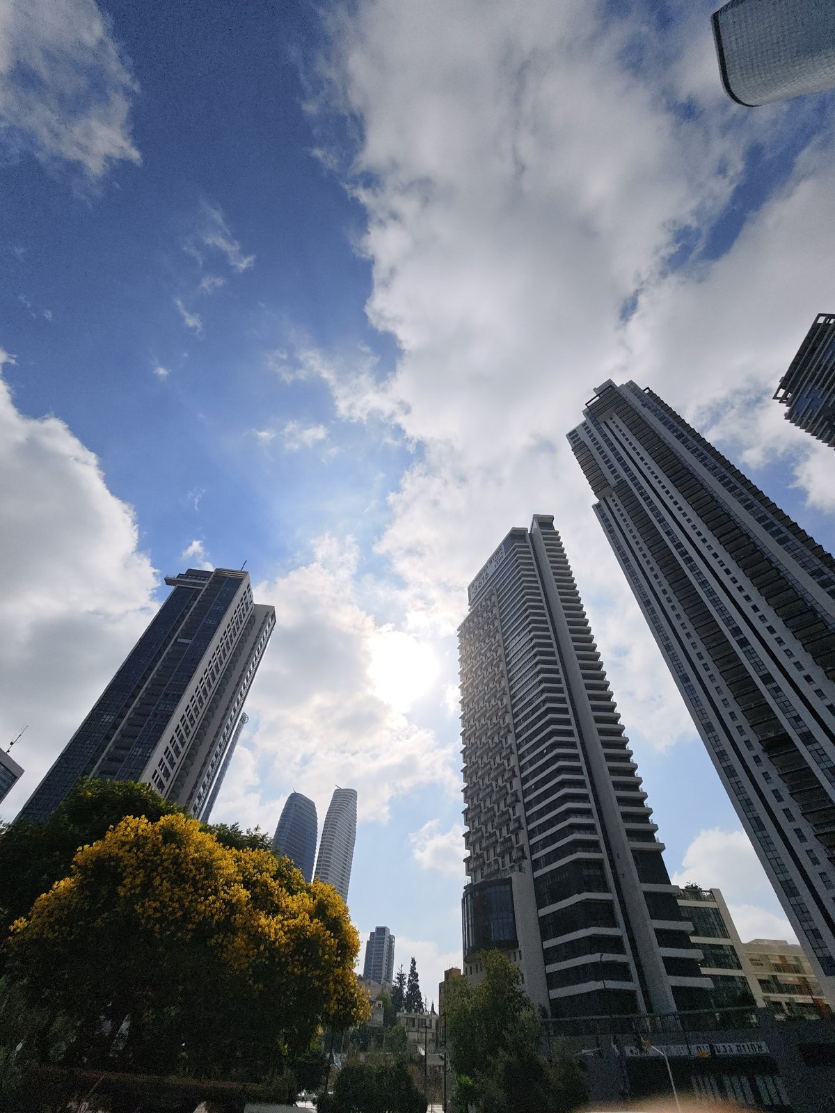 Modern high-rises along the Tel Aviv–Givatayim edge, sunny morning