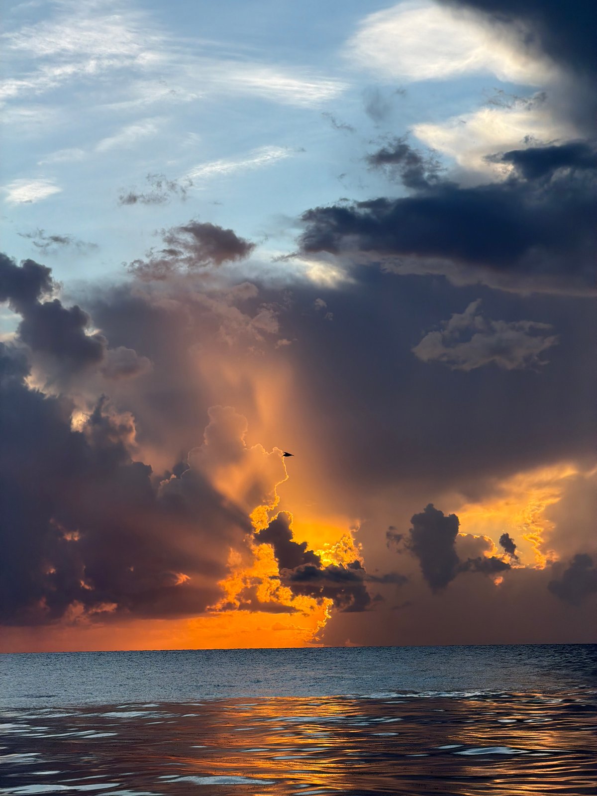 Storm clouds and sunlight collide over Miami Beach at sunset