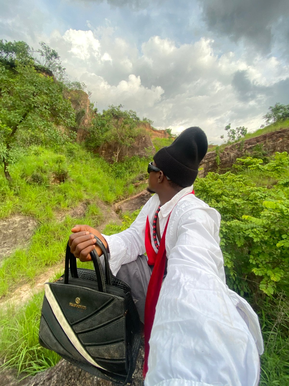 Outdoor photo session captured in Nigerian countryside with nature subjects