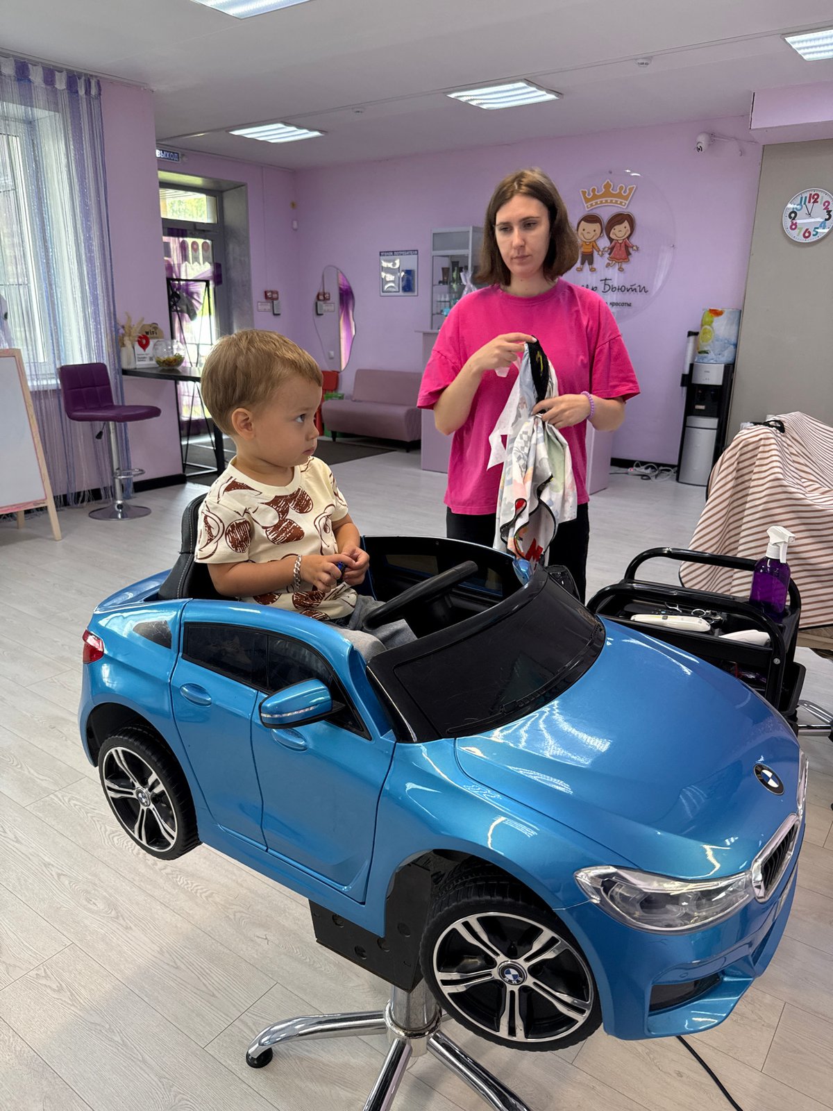 Toy car chair and cape at a Yaroslavl kids' salon