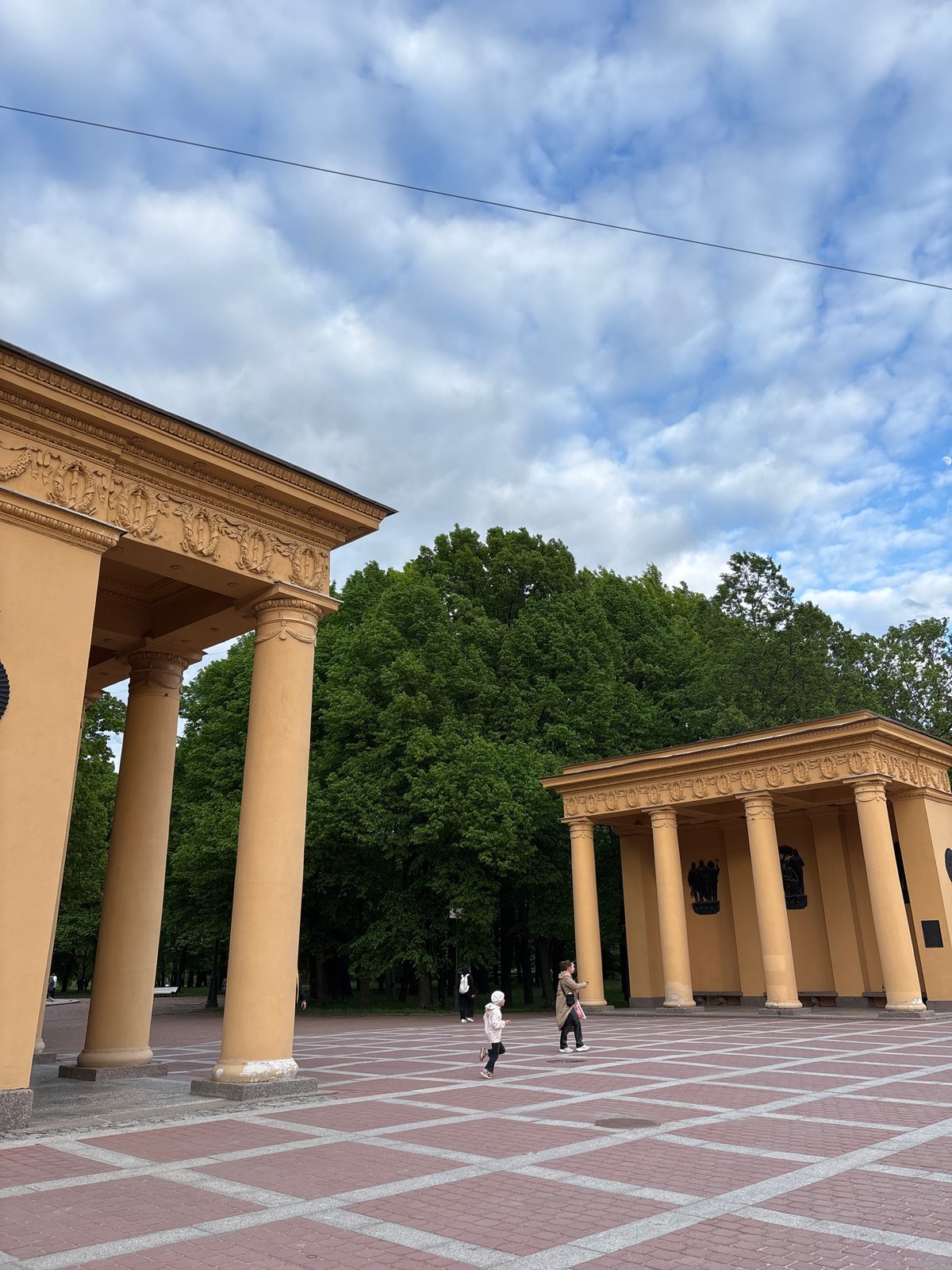 Yellow-columned buildings photographed in Saint Petersburg architectural complex