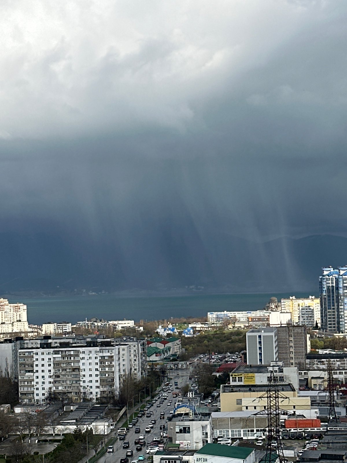 Cloudy coastal cityscape captured by unknown witness