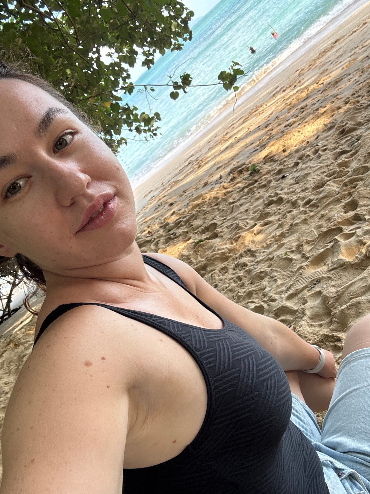 Lazy morning at Rawai Beach with kids, boats, and sand