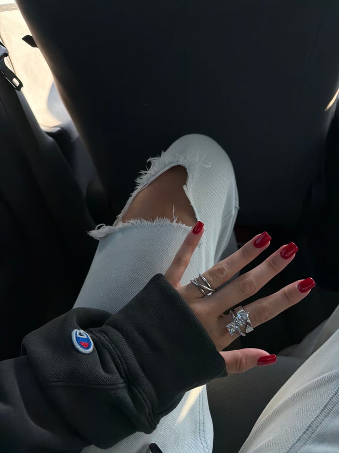 Person in Champion sweatshirt photographed inside car in Katunayake