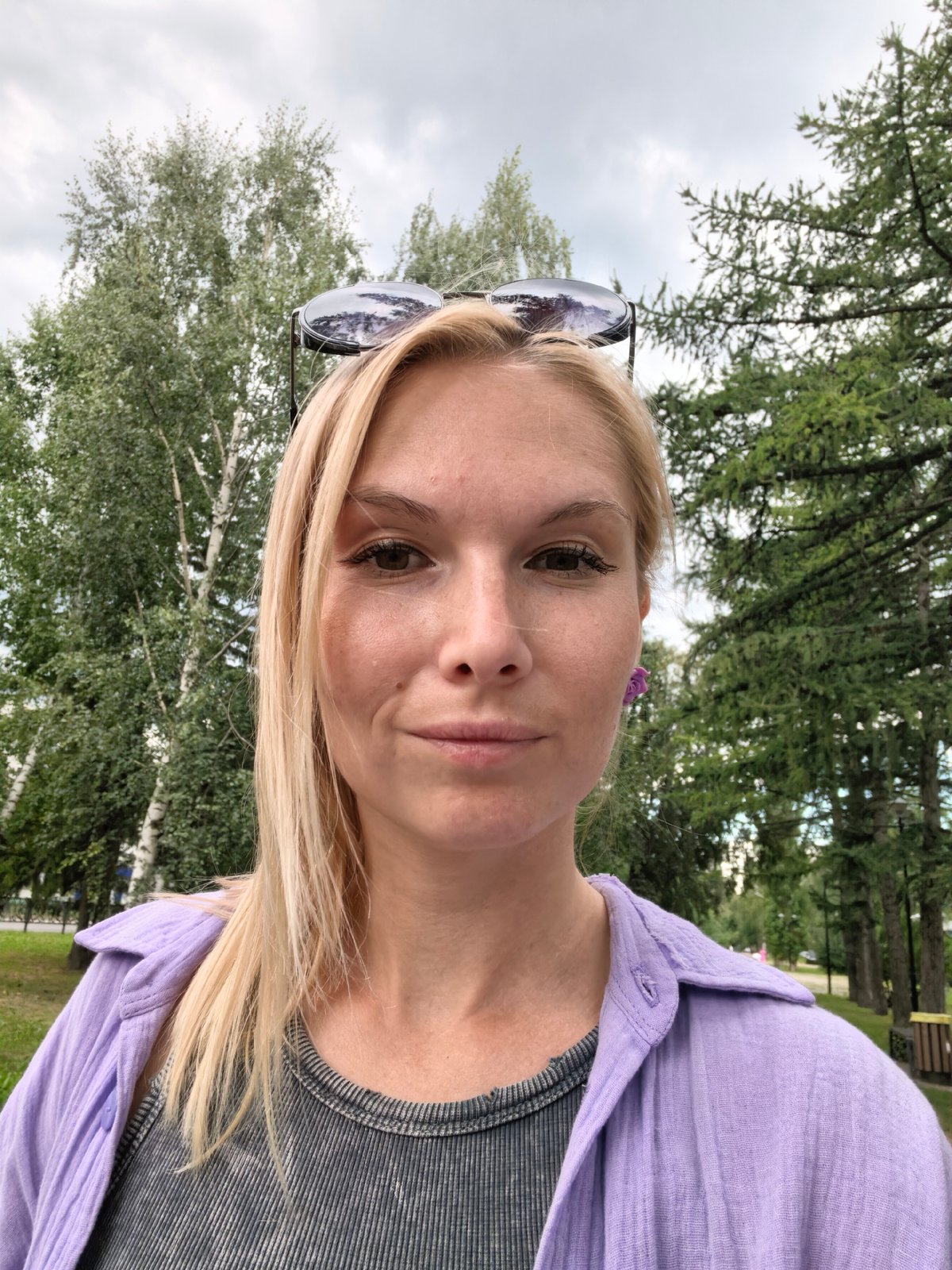 Cloudy morning out in Sterlitamak — trees, sky, and a food kiosk