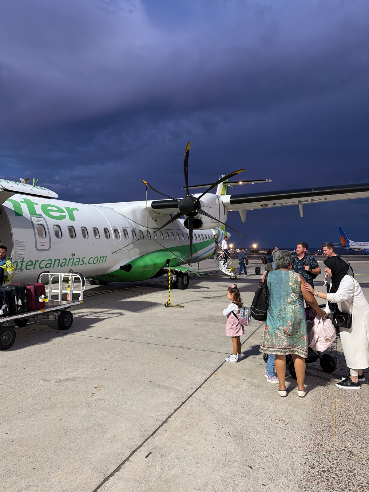 Turboprop aircraft spotted on evening tarmac in San Bartolomé