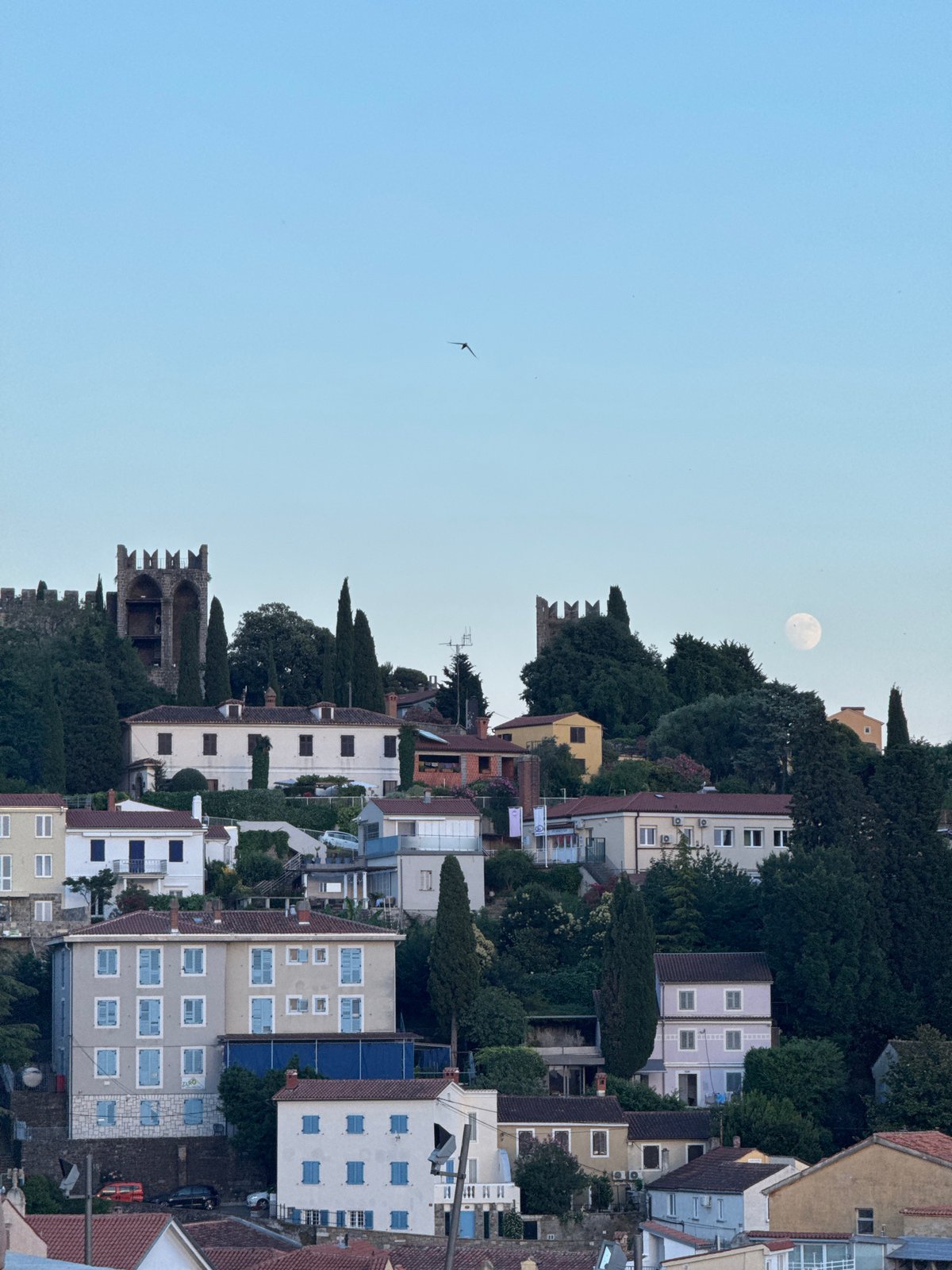 Piran at golden hour, sea, rooftops, and old town streets